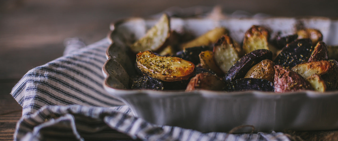 Herb-roasted fingerling potatoes with golden, crispy edges.