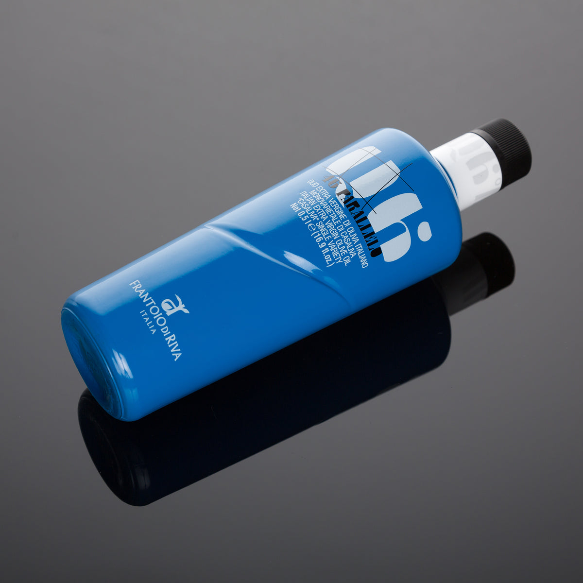 500 ml 46° Parallelo Casaliva bottle lying diagonally on a reflective surface.