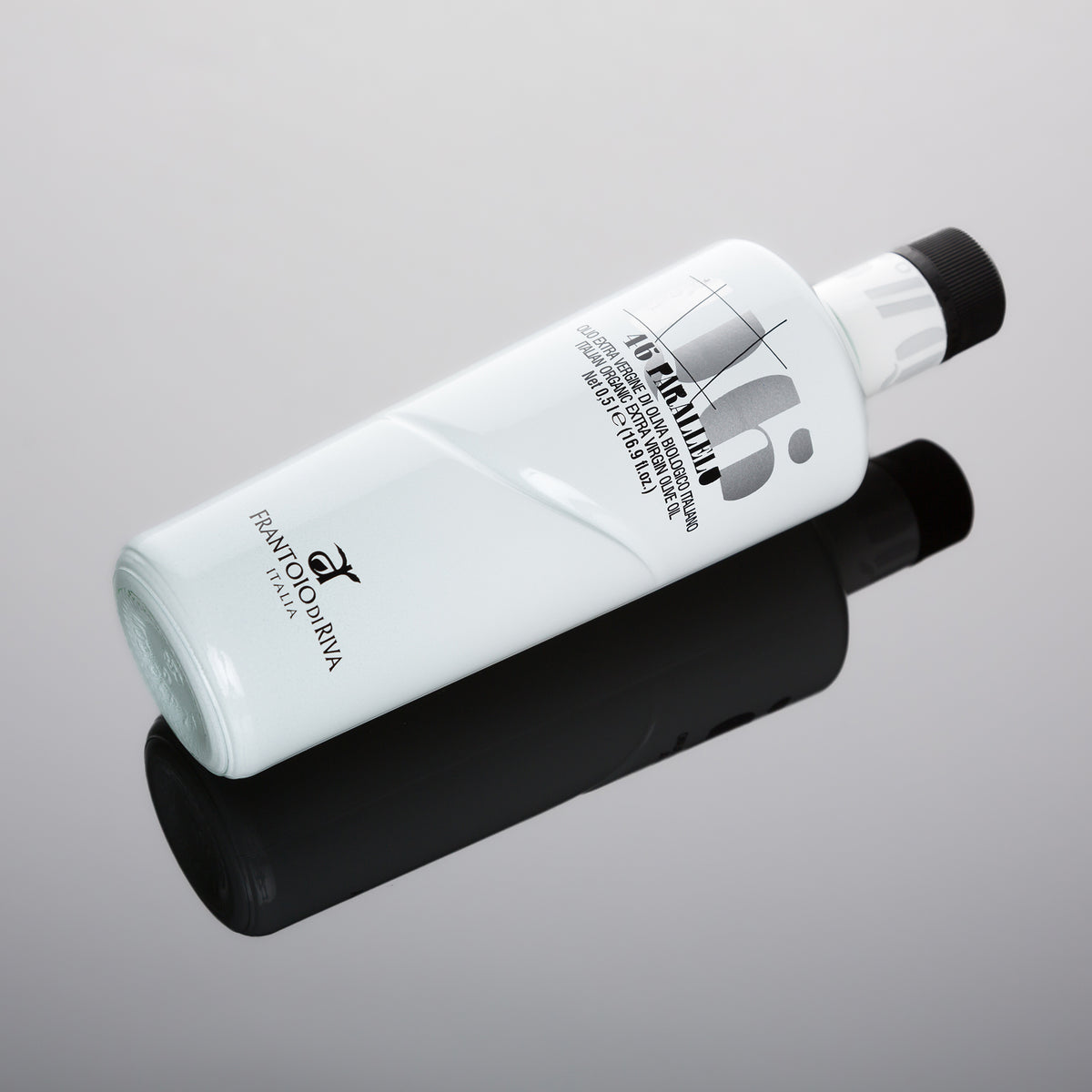 46° Parallelo Organic 500 ml olive oil bottle on a reflective surface.