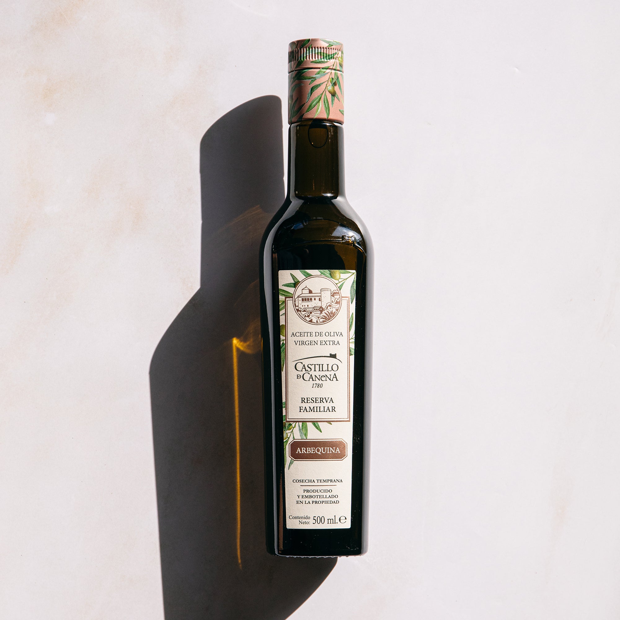 500 ml Castillo de Canena Family Reserve Arbequina bottle in bright sunlight.