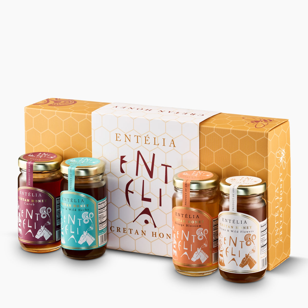 Four 100 g Entelia Cretan honeys; Carob, Pine & Wild Herbs, Orange Blossom, and Thyme & Wild Flowers, with gift box.