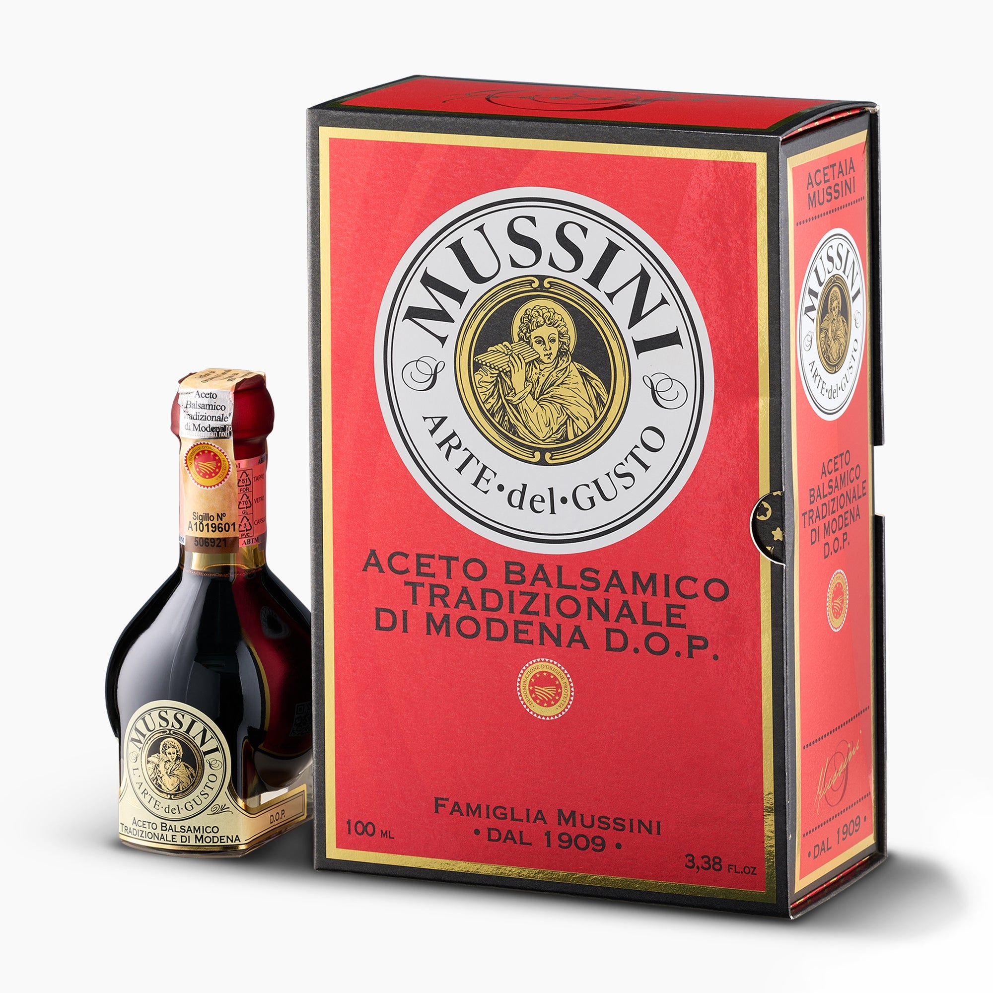 Mussini 12-year Traditional Balsamic Vinegar of Modena DOP, 100 ml bottle beside its elegant red gift box.