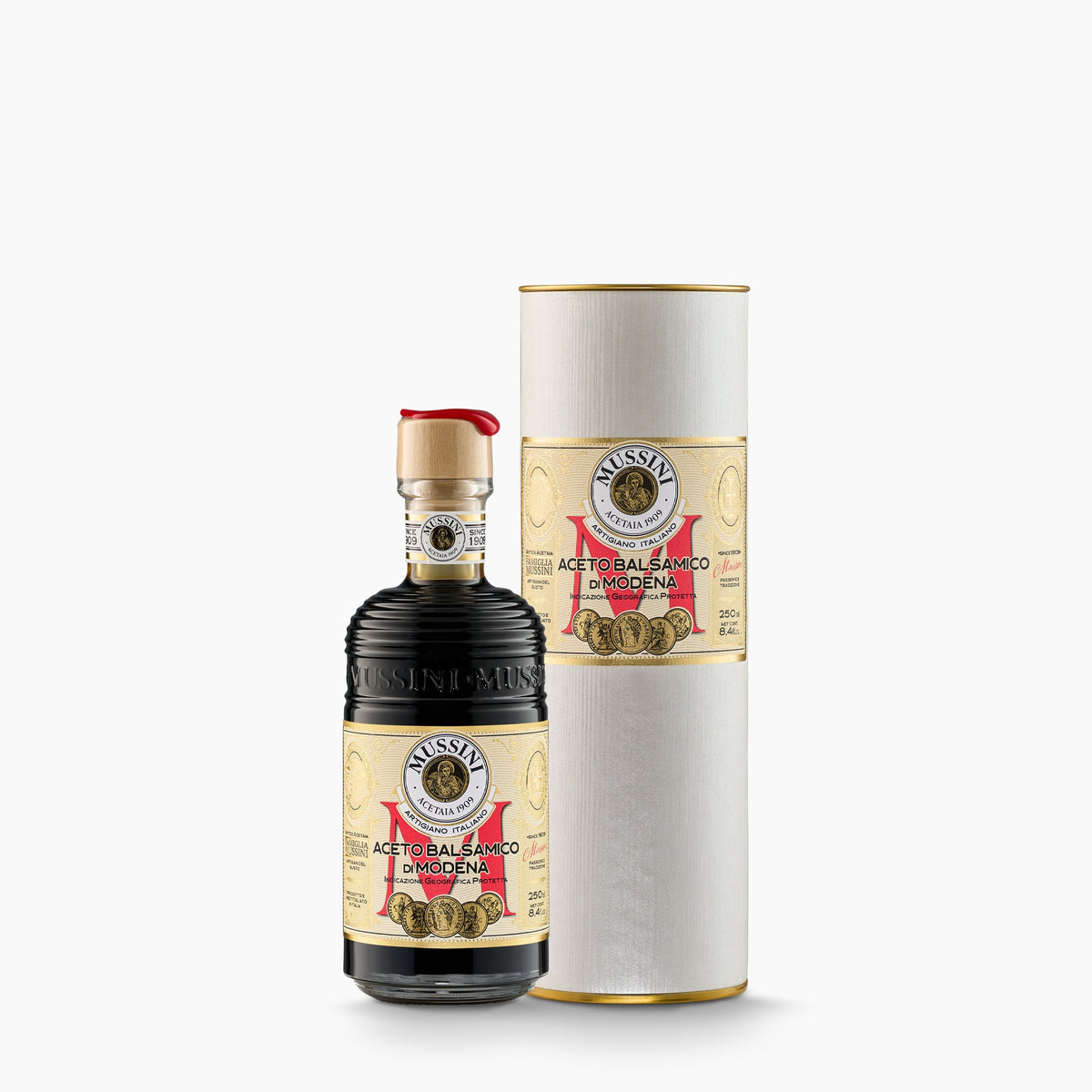 250 ml bottle of Mussini Belle Epoque 5 Medal Balsamic Vinegar of Modena IGP beside its Gift Tube.