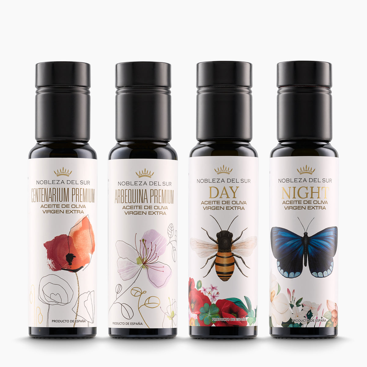 Four 100 ml Nobleza del Sur olive oil bottles: Centenarium Premium, Arbequina Premium, Day, and Night.