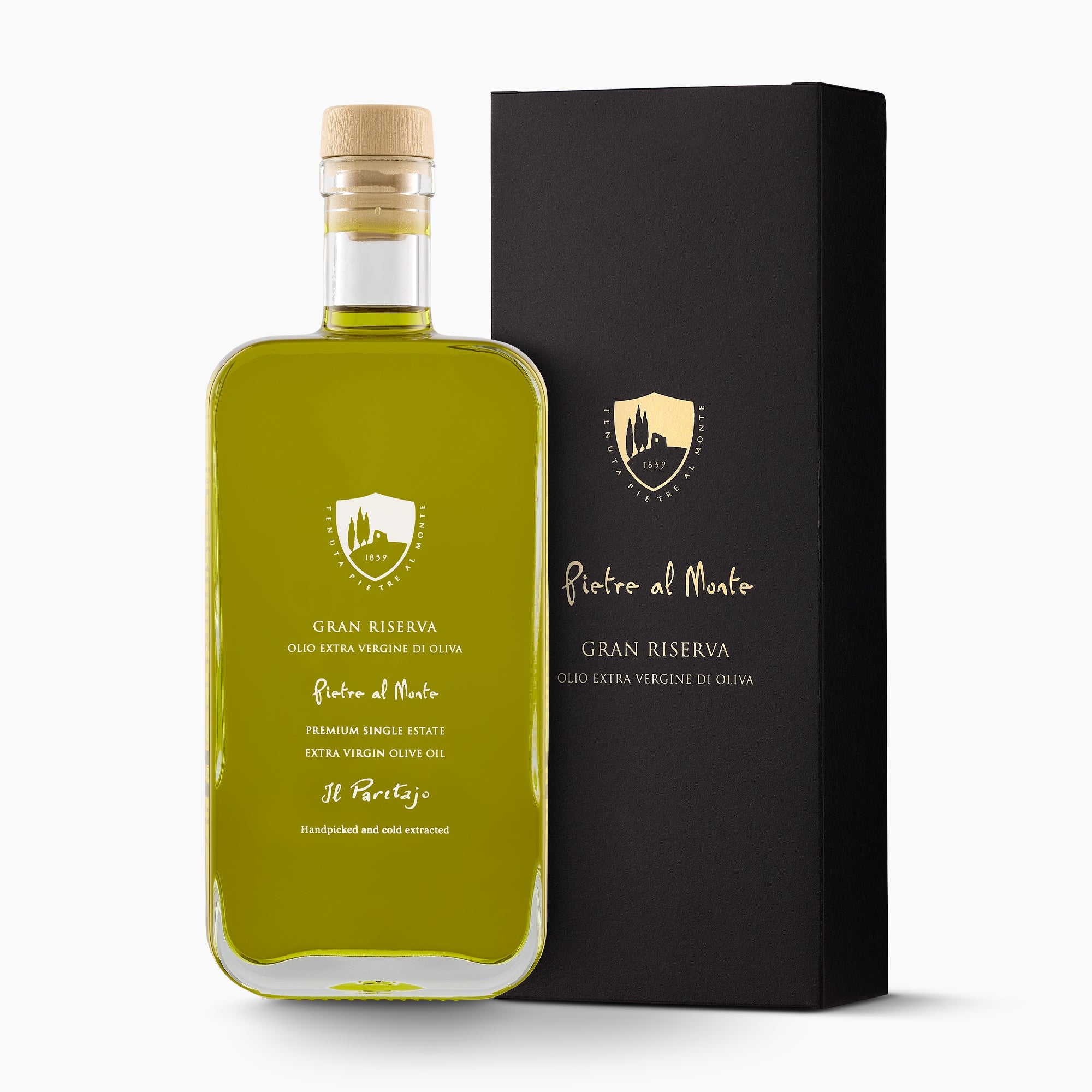 A bottle of Pietre al Monte Gran Riserva extra virgin olive oil, and its gift box.