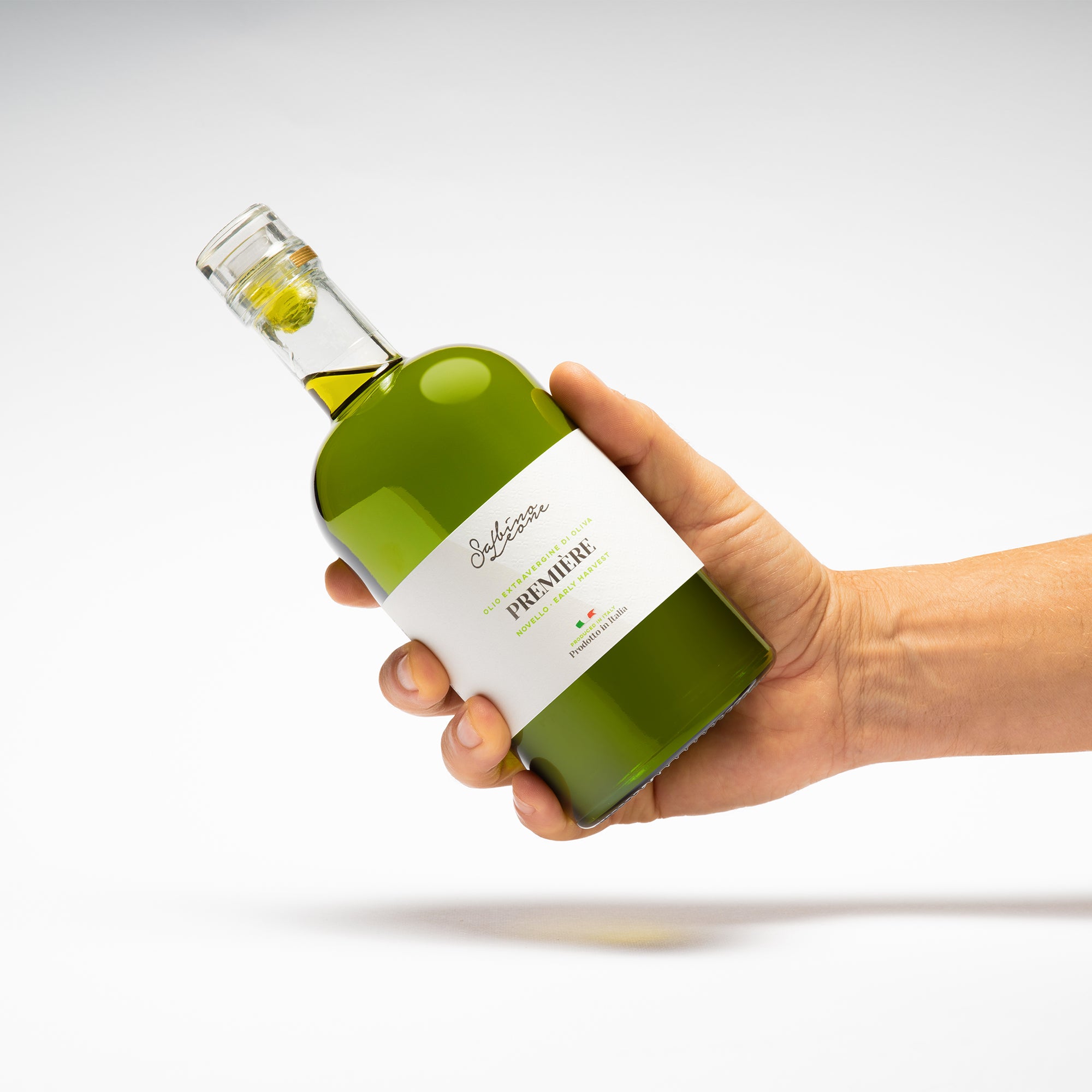 Holding the 500 ml Sabino Leone Première Novello bottle.