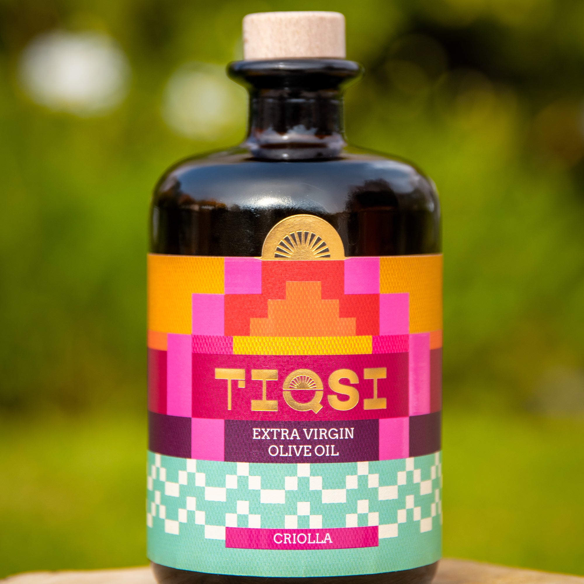 TIQSI Criolla 500 ml Peruvian extra virgin olive oil bottle with colorful geometric label.