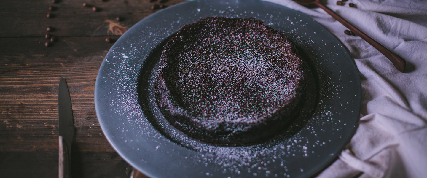 Chocolate cake with powdered sugar.