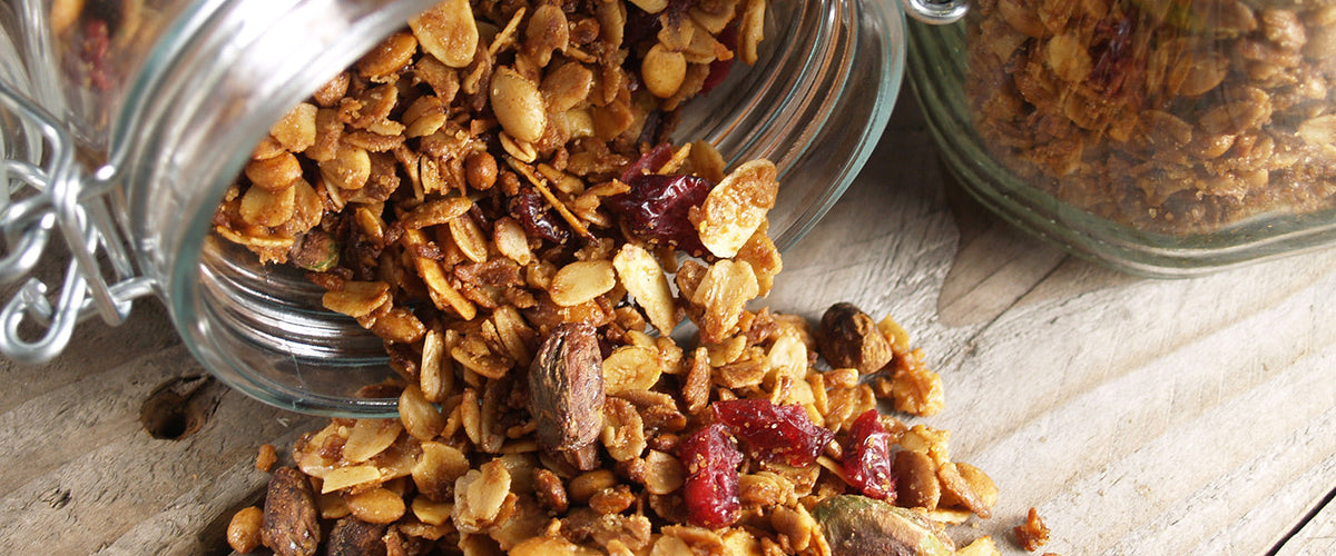 Homemade granola with toasted oats, nuts, seeds, and dried cranberries.