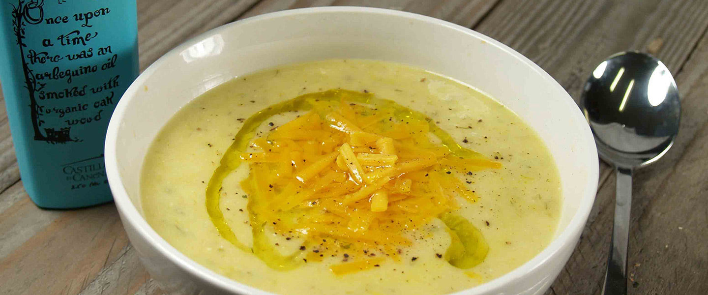 Creamy potato leek soup topped with shredded cheddar, cracked pepper, and olive oil.