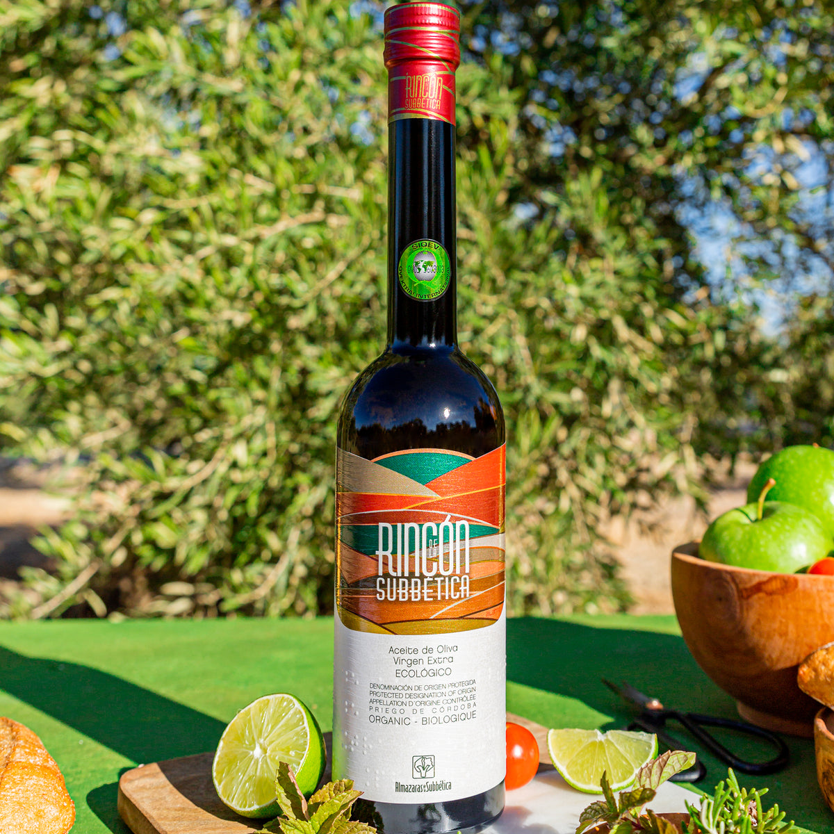Rincón de la Subbética bottle with limes, herbs, vegetables.