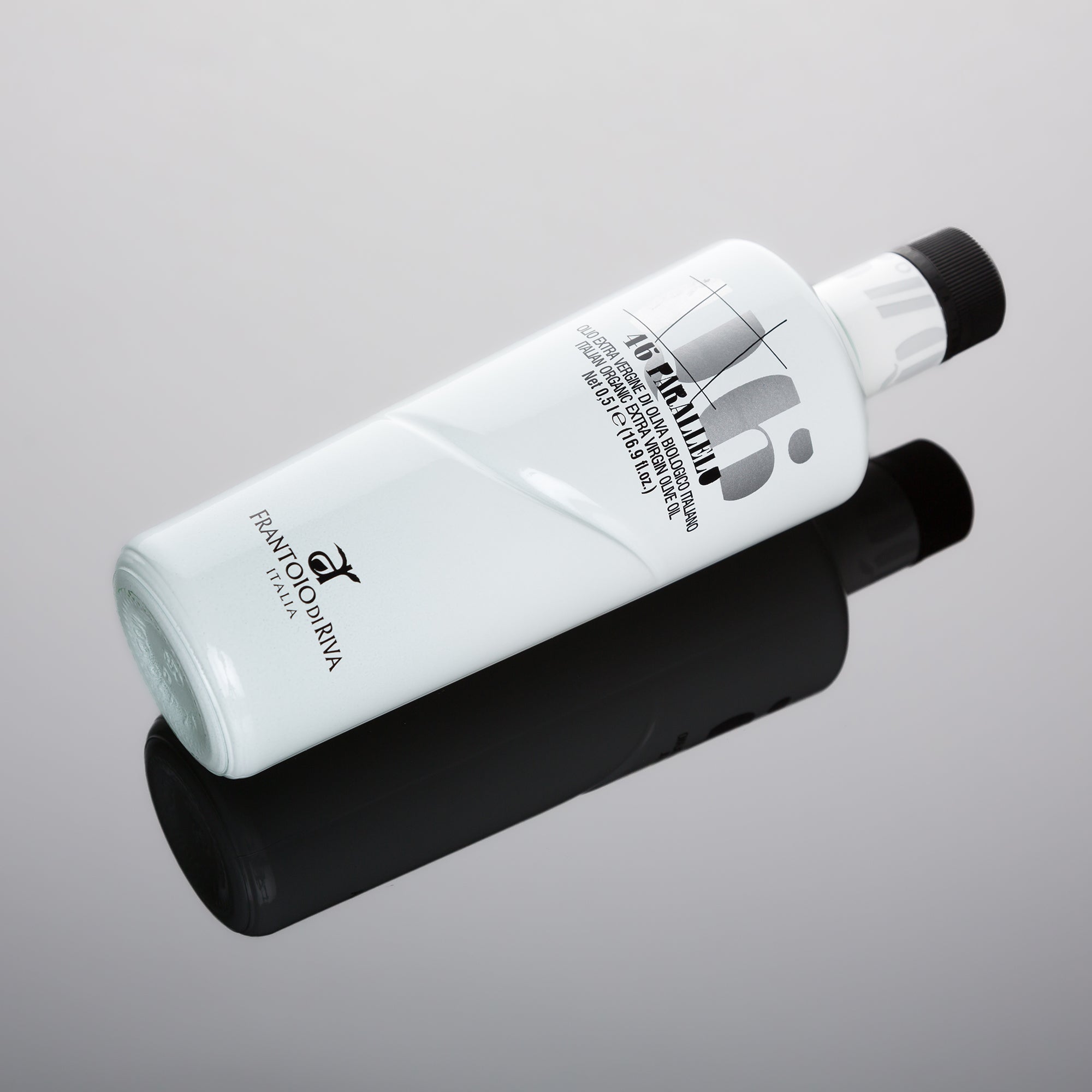 46° Parallelo Organic 500 ml olive oil bottle on a reflective surface.