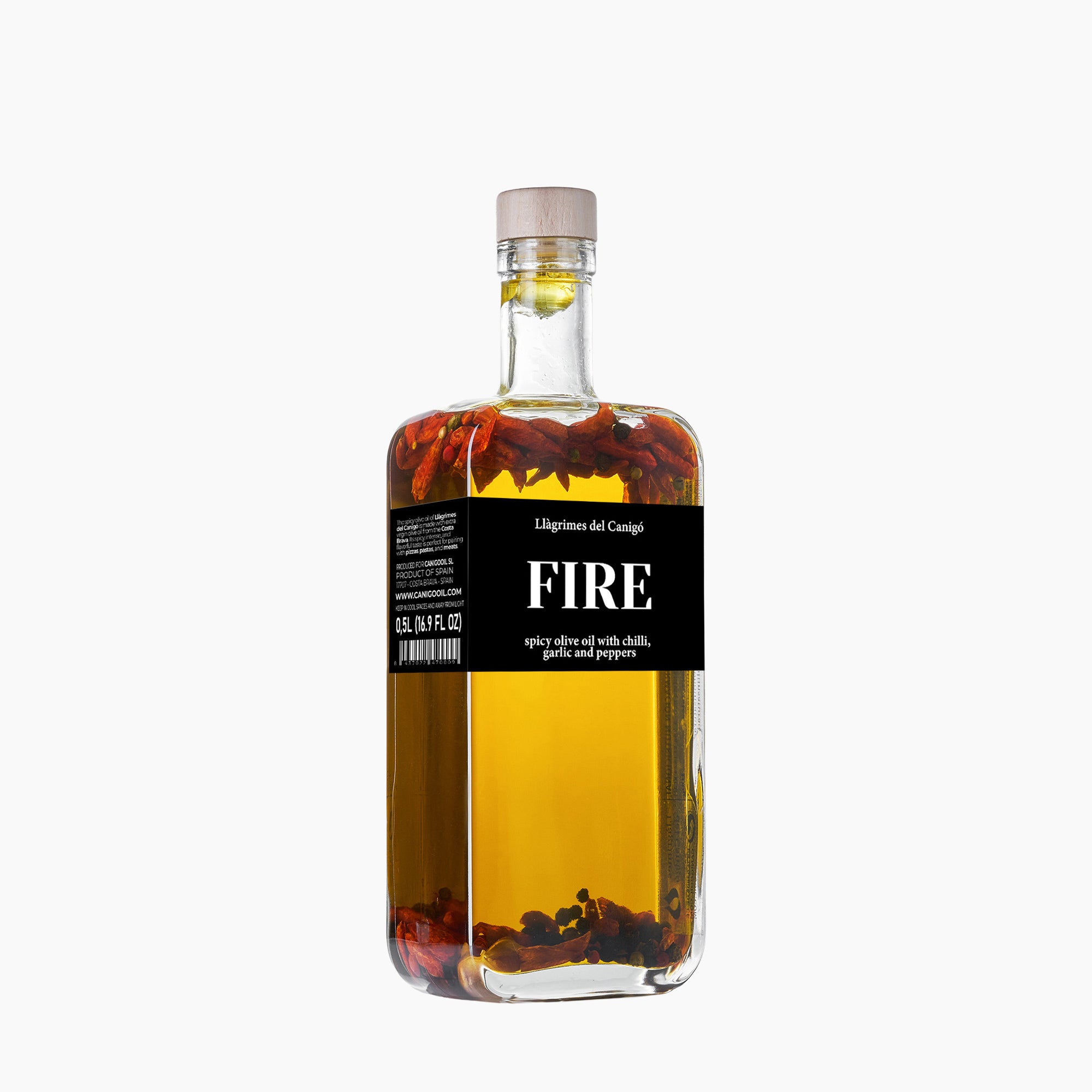 Angled view of Llàgrimes del Canigó Fire  500 ml extra virgin olive oil bottle.
