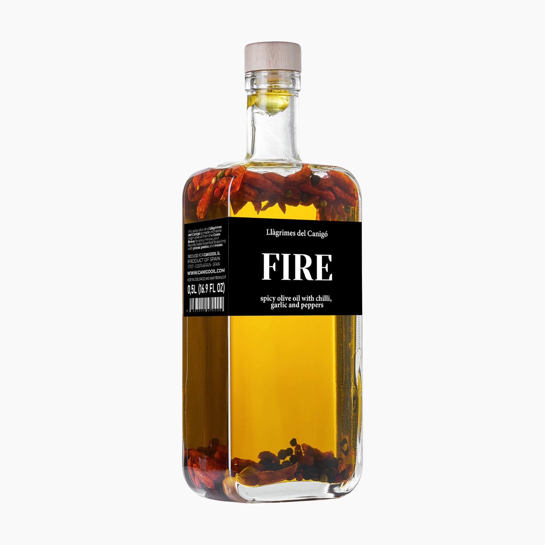 Angled view of Llàgrimes del Canigó Fire  500 ml extra virgin olive oil bottle.