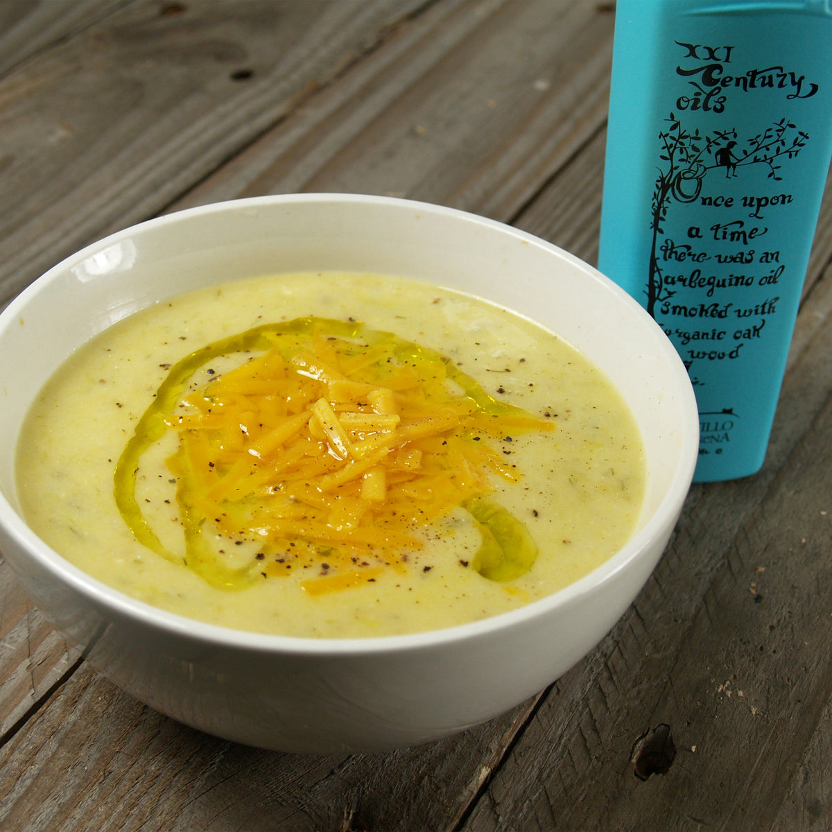 Bowl of creamy soup drizzled with Castillo de Canena Smoked Arbequina olive oil.