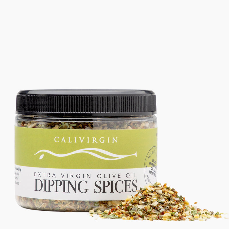 Calivirgin Dipping Spices jar beside a small pile of the seasoning blend.