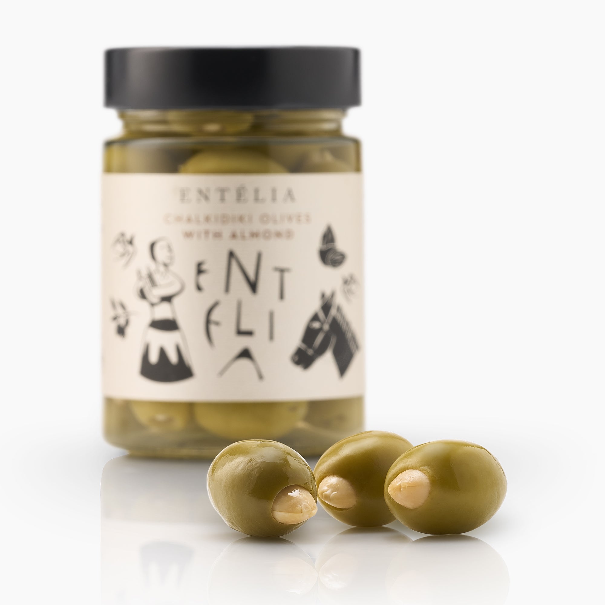 Three almond-stuffed Entelia Chalkidiki olives and a 360g Entelia jar behind them.
