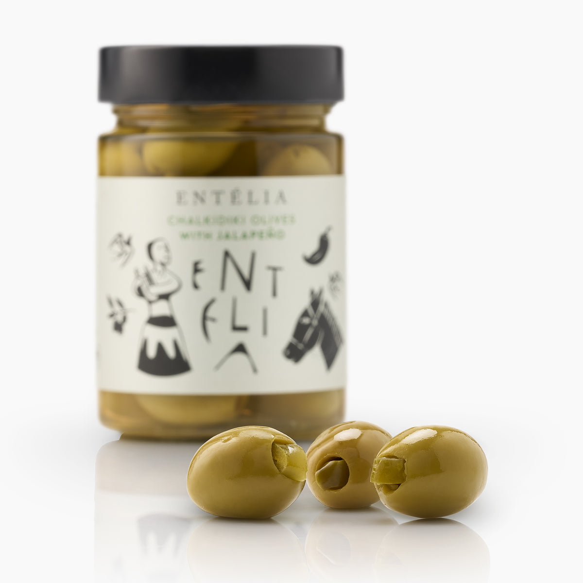 Three jalapeño-stuffed Entelia Chalkidiki olives and a 360g Entelia jar behind them.