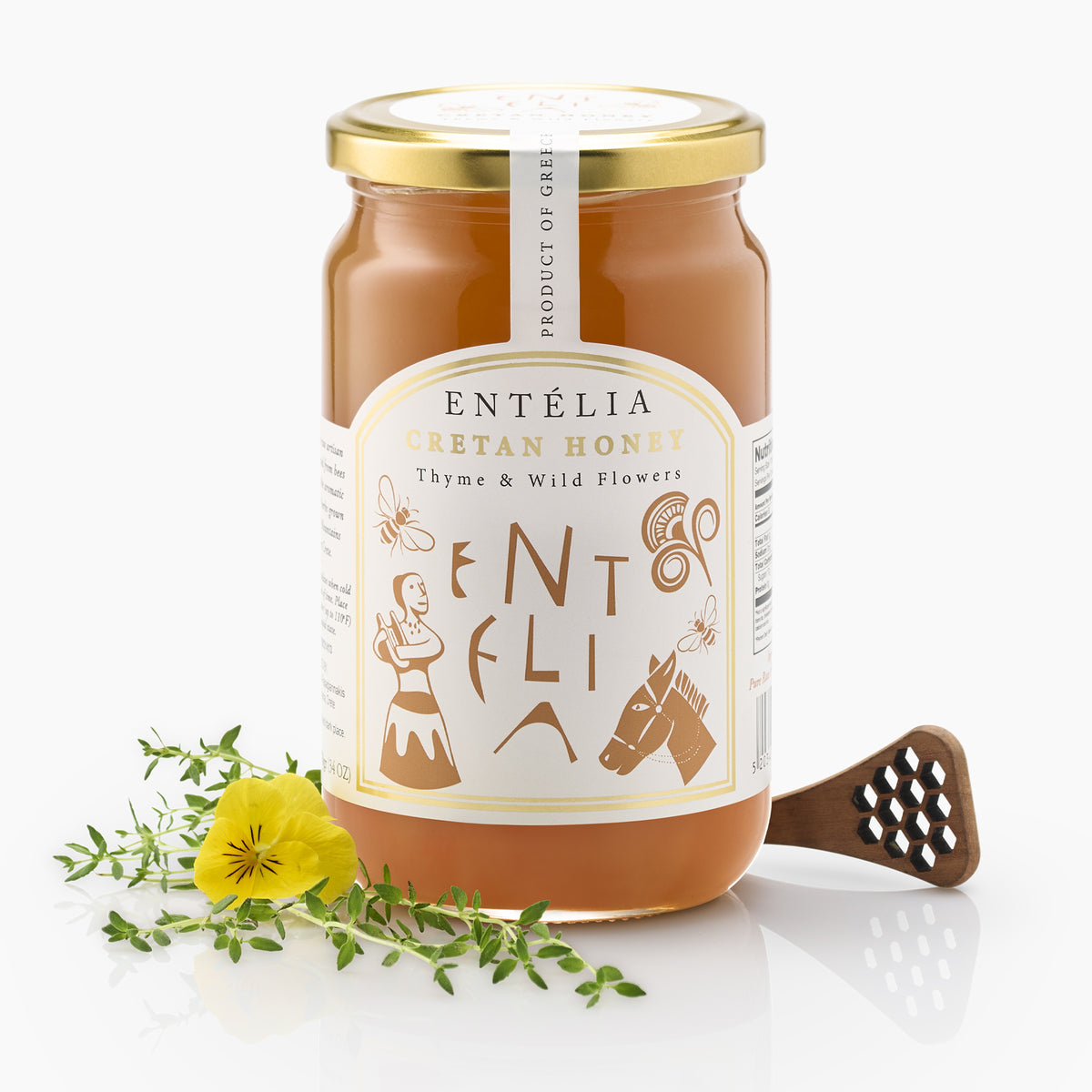 Entelia Thyme & Wild Flowers Cretan Honey 970g jar with yellow flower, thyme, and a honey dipper.