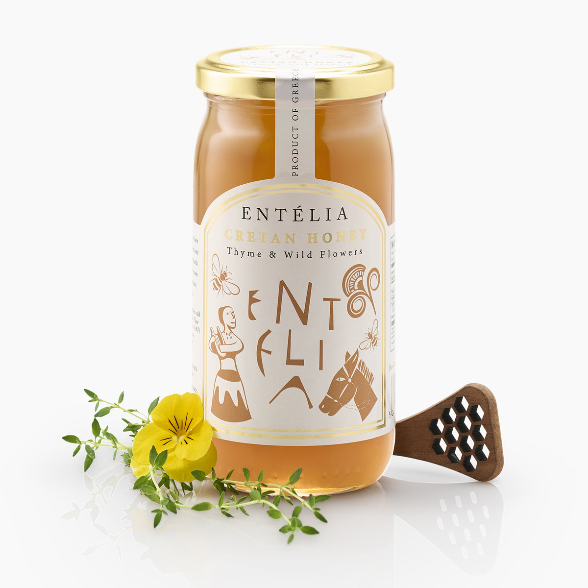 Entelia Thyme & Wild Flowers Cretan Honey 450g jar with yellow flower, thyme, and a honey dipper.