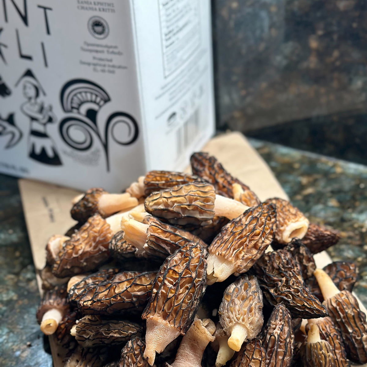 Fresh morel mushrooms beside an Entelia 5L bag-in-box.