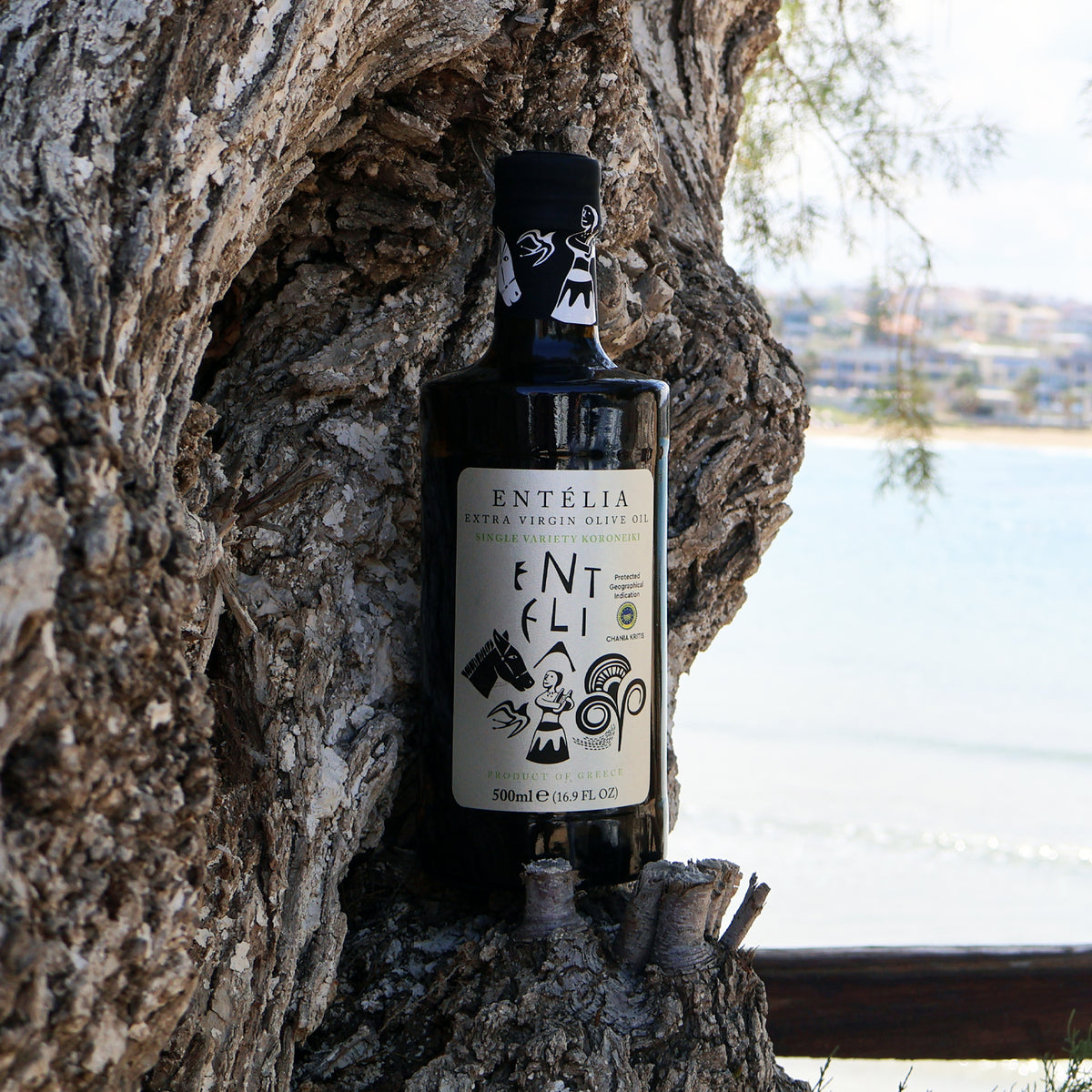 500ml Entelia extra virgin olive oil bottle on an olive tree.