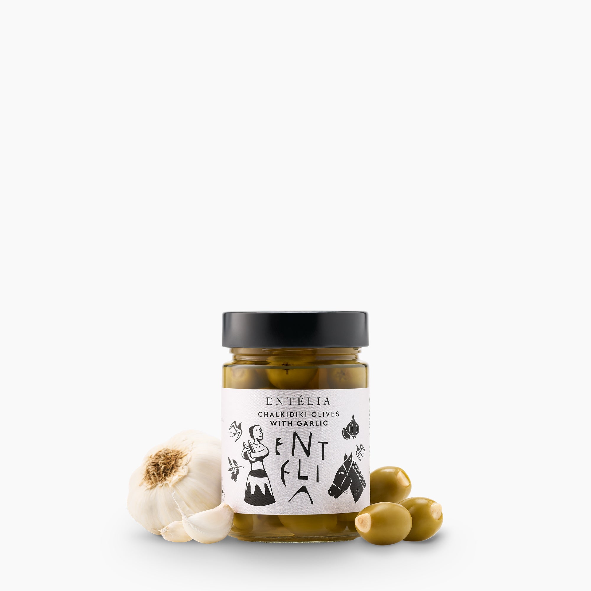 Entelia Chalkidiki Olives with Garlic jar surrounded by garlic, and stuffed olives.