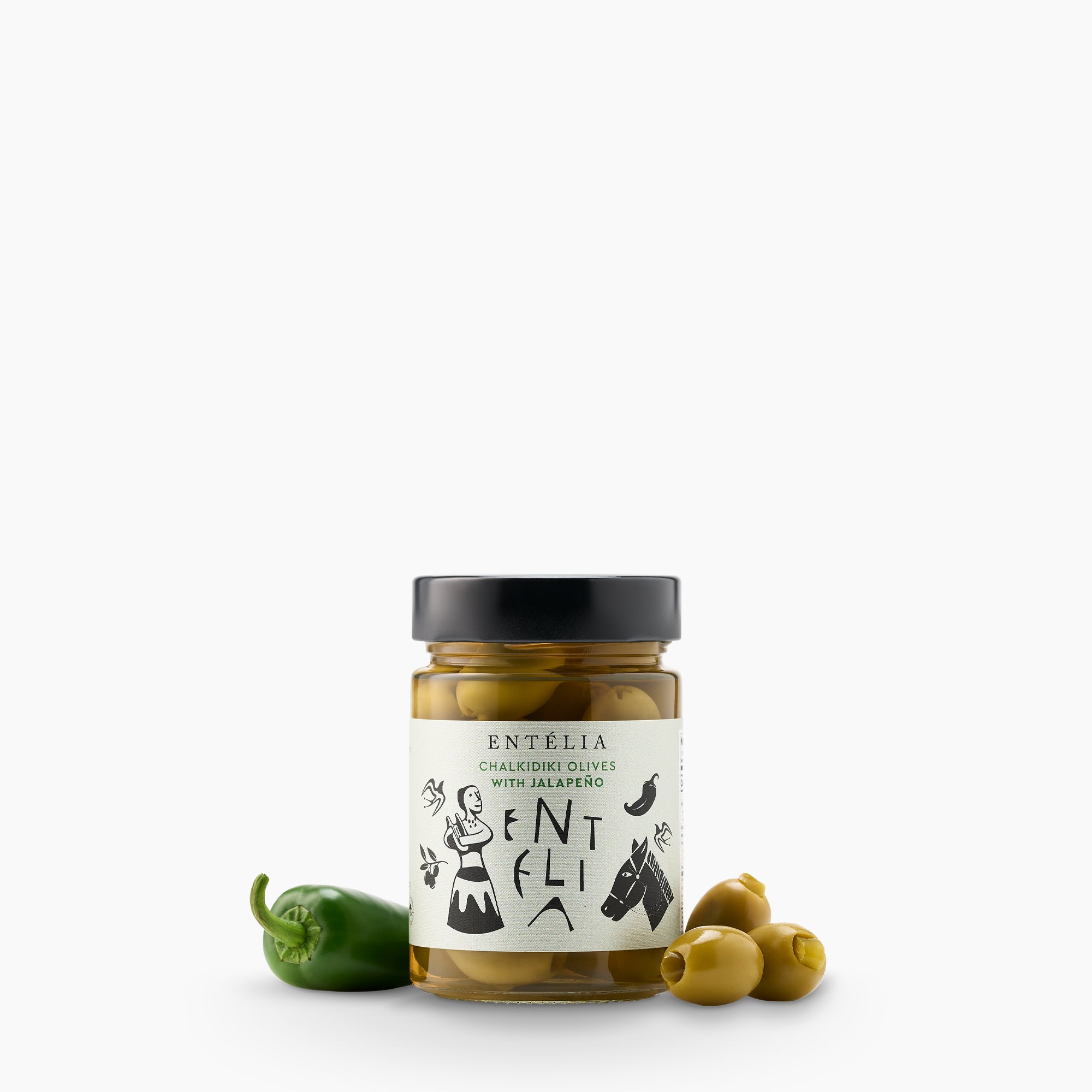Entelia Chalkidiki Olives with Jalapeño jar beside olives and a fresh jalapeño.