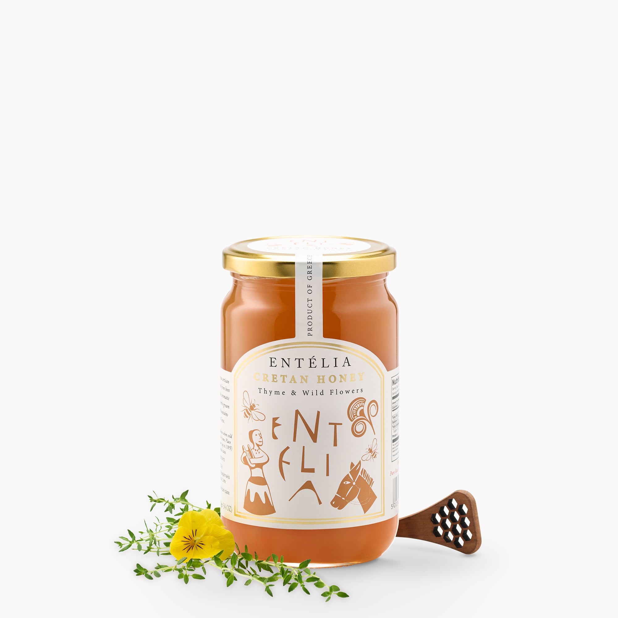 Entelia Thyme & Wild Flowers Cretan Honey 970g jar with yellow flower, thyme, and a honey dipper.