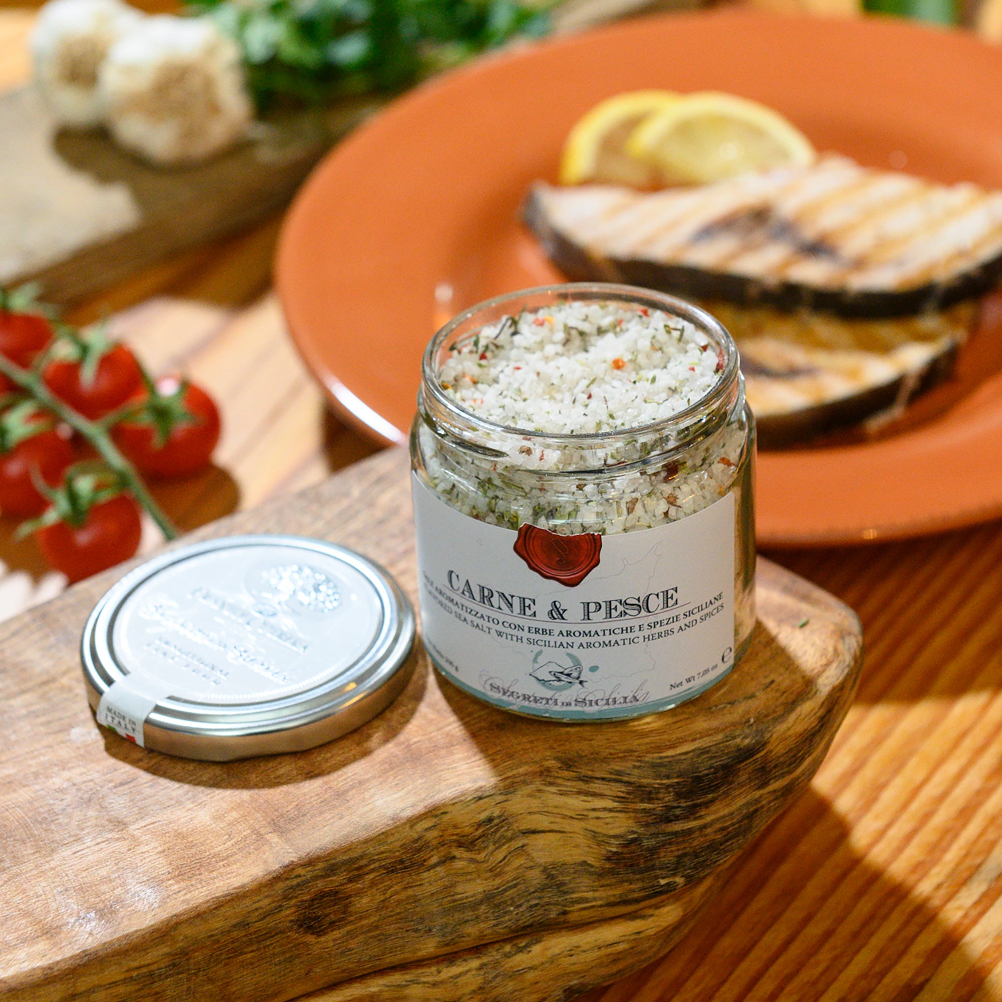 Open jar of Frantoi Cutrera Carne & Pesce Sicilian Sea Salt with Herbs & Spices.