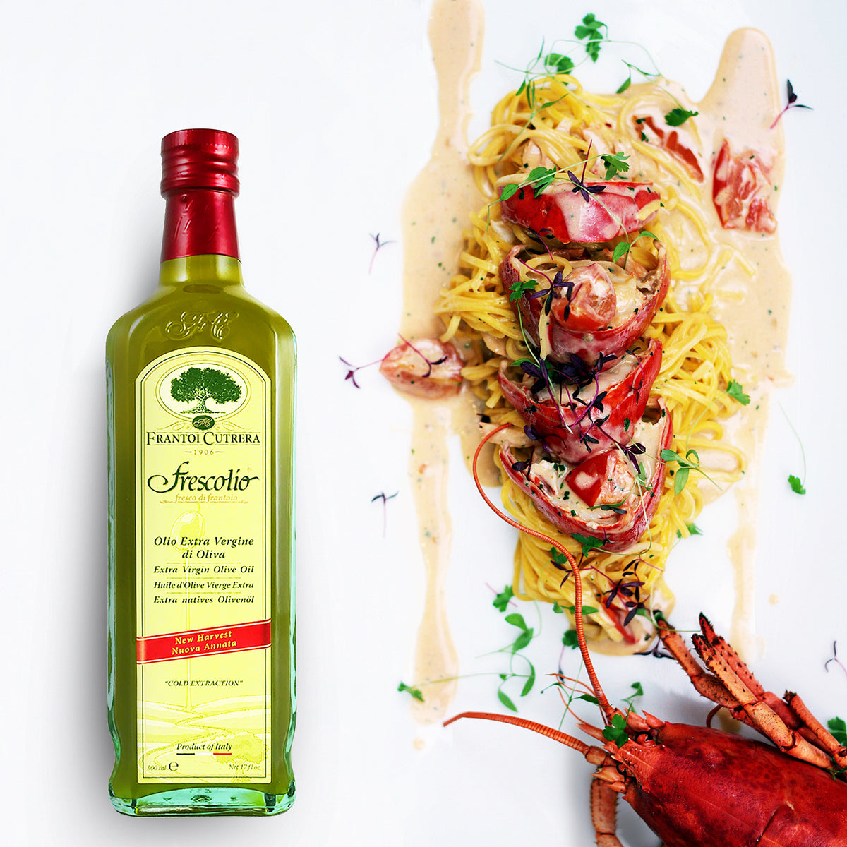 Frescolio Novello 500ml bottle beside lobster pasta with creamy sauce.
