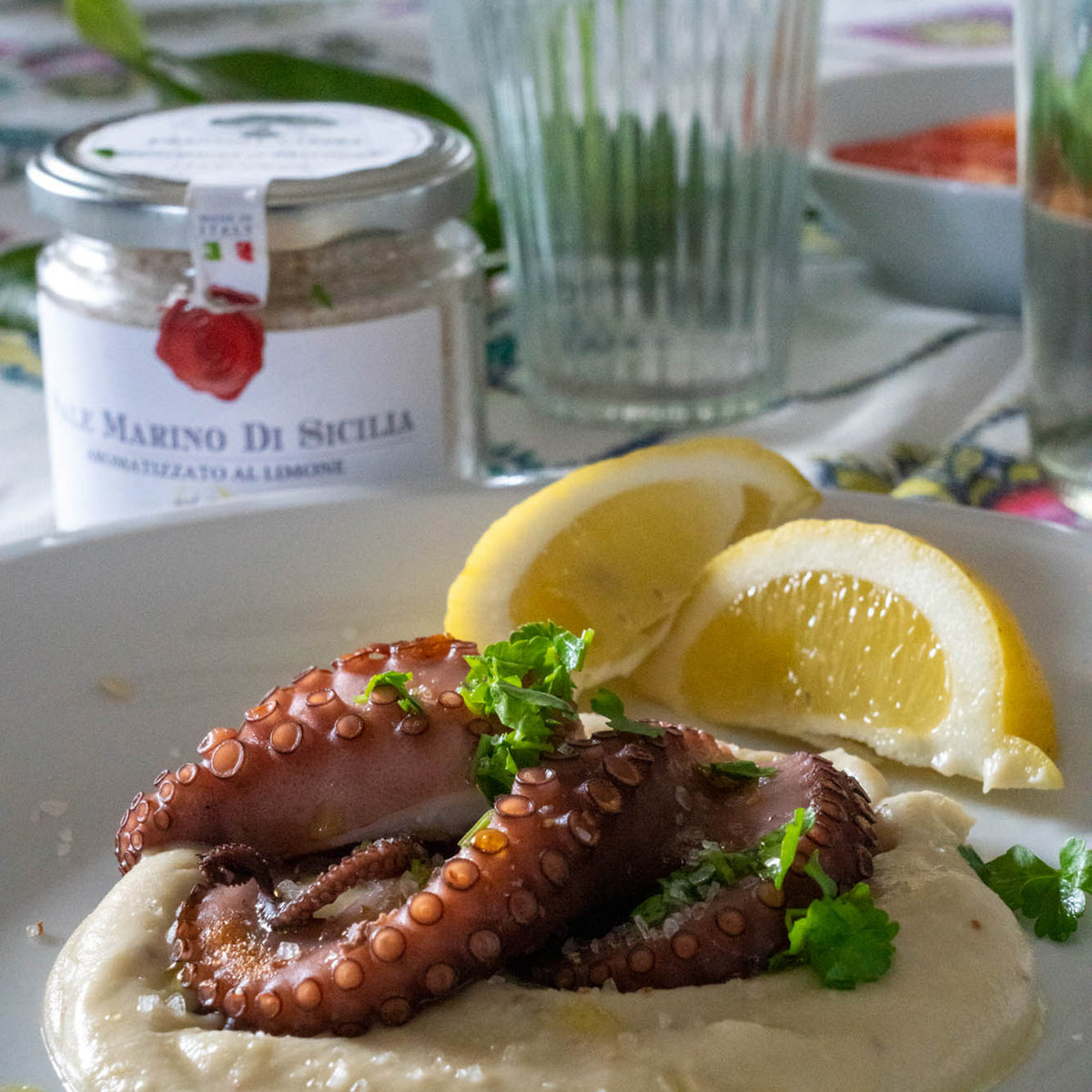 Octopus served with Frantoi Cutrera Sicilian Sea Salt, creamy purée, parsley, and lemon wedges.