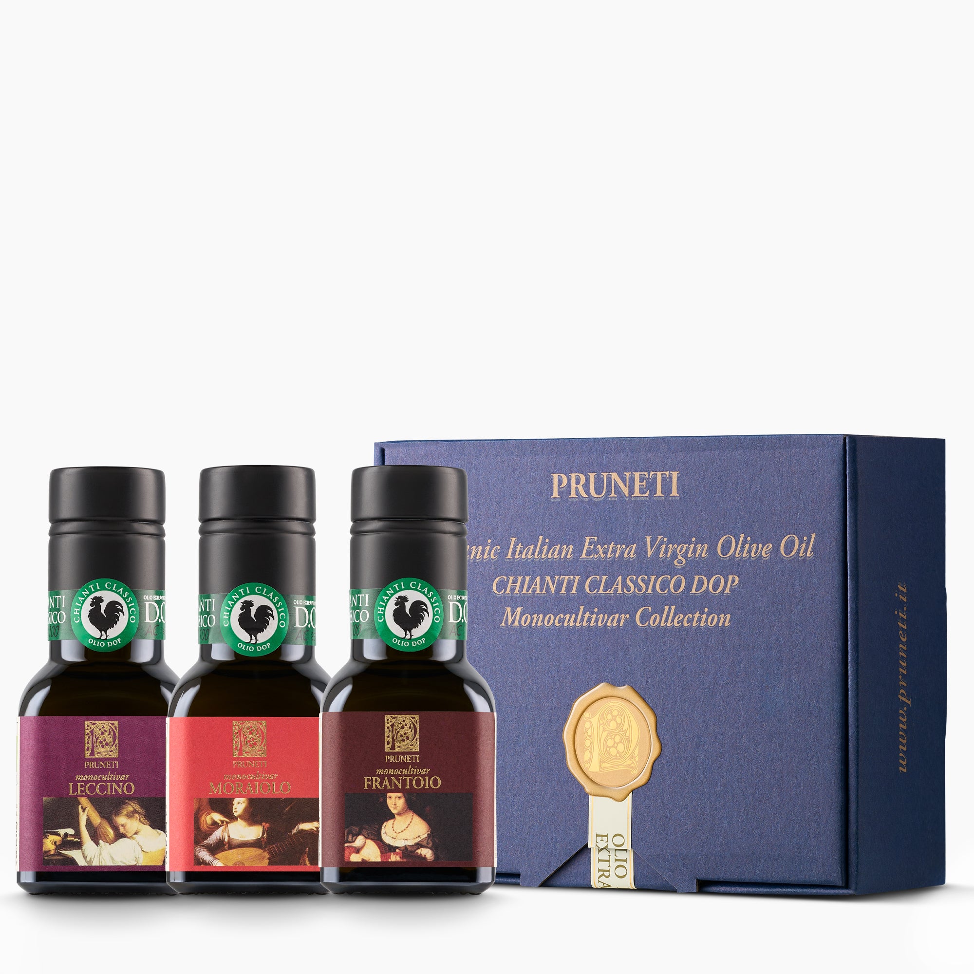 Three 100 ml Pruneti olive oils—Leccino, Moraiolo, and Frantoio—beside an elegant blue gift box.