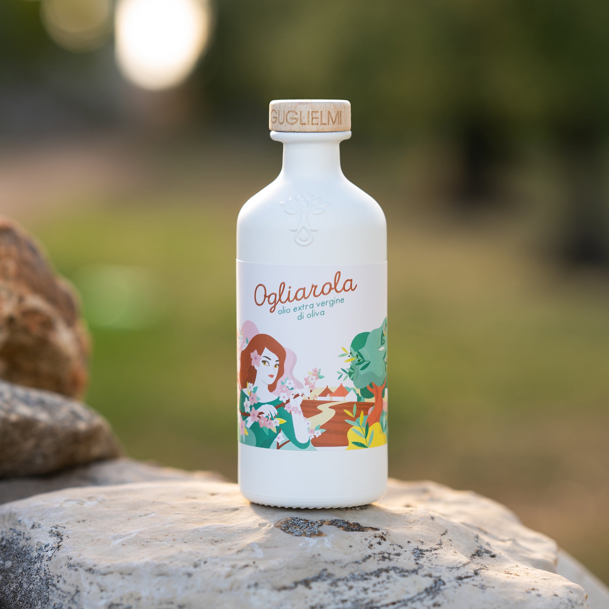 500 ml Guglielmi Ogliarola olive oil bottle on a stone surface.