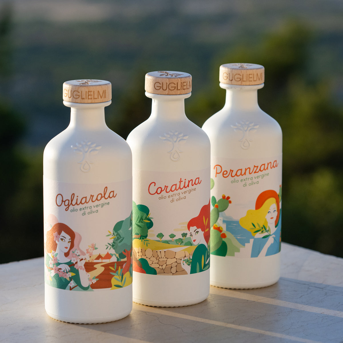Three Guglielmi Le Monocultivar bottles; 500 ml Ogliarola, Coratina, and Peranzana varieties.