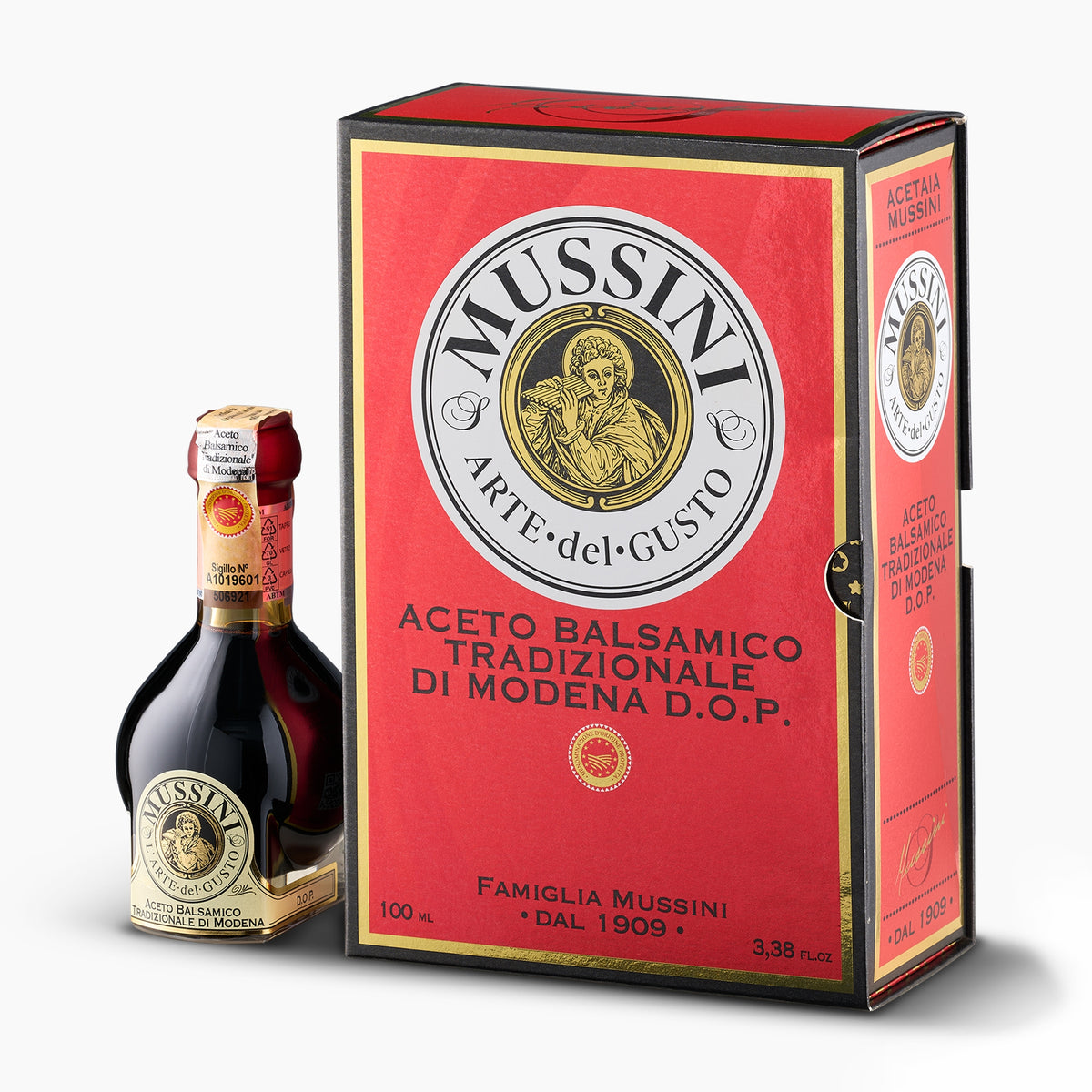 Mussini 12-year Traditional Balsamic Vinegar of Modena DOP, 100 ml bottle beside its elegant red gift box.