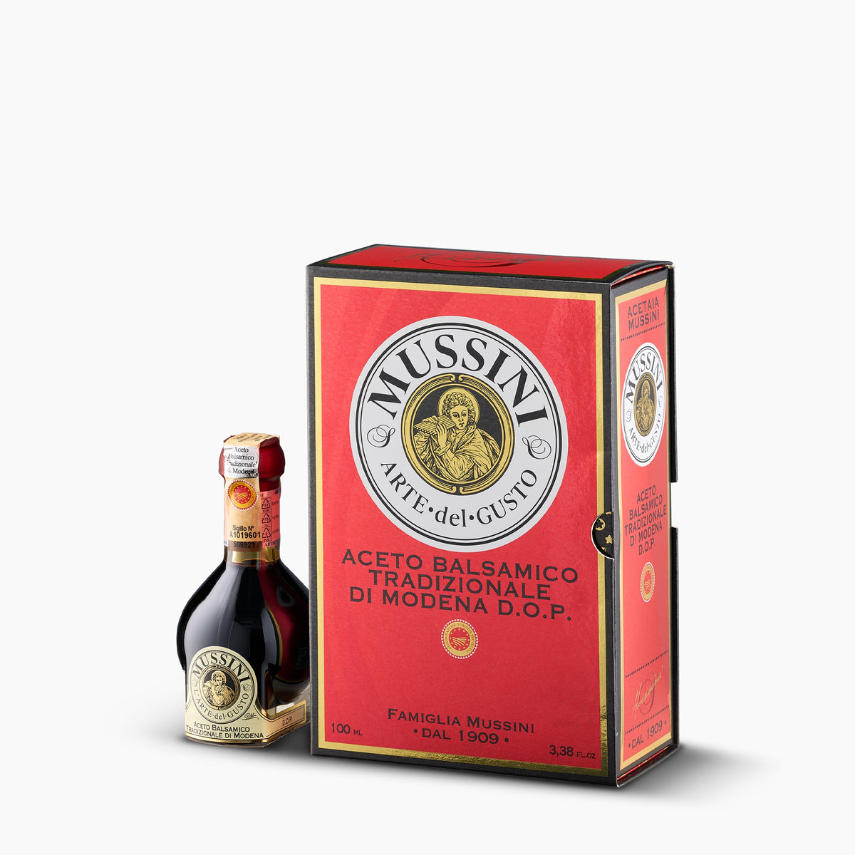 Mussini 12-year Traditional Balsamic Vinegar of Modena DOP, 100 ml bottle beside its elegant red gift box.