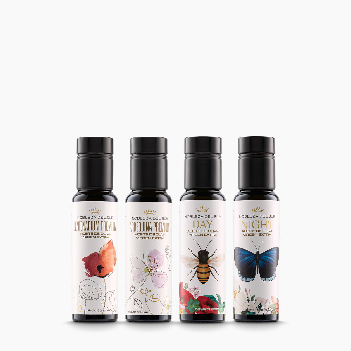 Four 100 ml Nobleza del Sur olive oil bottles: Centenarium Premium, Arbequina Premium, Day, and Night.