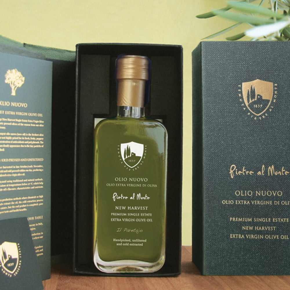 Pietre al Monte Olio Nuovo bottle in an open gift box.