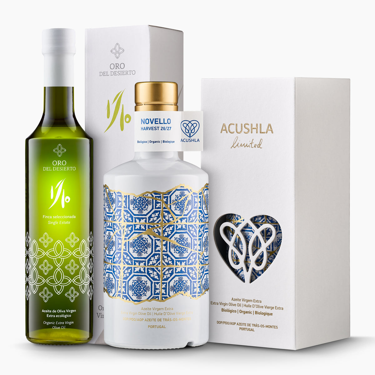 500ml bottles of Oro del Desierto Organic 1/10 Novello and Acushla Organic DOP Trás-os-Montes Novello with their gift boxes.