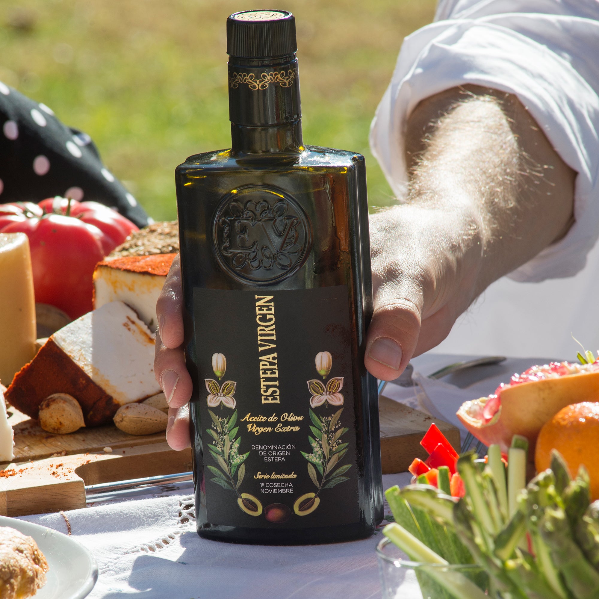 An Estepa Virgen extra virgin olive oil bottle placed on a table.